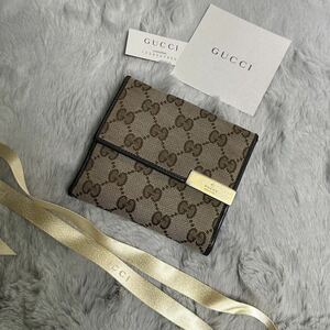 美品　GUCCI グッチ　折り財布　キャンバスGG メタルロゴ　ブラウン　