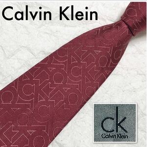 ■美品■Calvin Klein カルバンクライン　ネクタイ　CKロゴ総柄　シルク100% 日本製　ボルドー