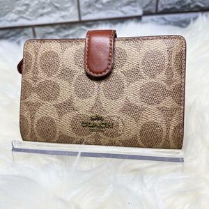 【美品】　coach 財布　ラウンドジップ　二つ折り　シグネチャー　ブラウン