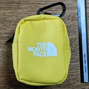 【送料無料1円〜未使用新品】THE NORTH FACE（ザ・ノースフェイス）/ナイロンカラビナミニポーチ イエロー 9x7x5.5cm 10