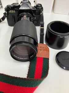 A【11D47】 Canon キヤノン レンズ フィルムカメラ FD AE-1 70-210mm f4 本体のみ　首掛けベルト付き　中古品