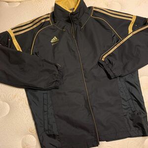 アディダスプロフェッショナルadidas Professional メンズ OサイズCLIMAPROOFウィンドブレーカーナイロンジャケット黒ブラックゴールド美品