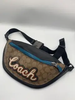 コーチCOACH ボディバッグ ベージュ 黒 青 ロゴ刺 繍 F76795