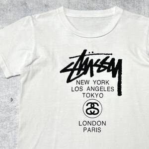 STUSSY キッズ150位 ワールドツアー 両面 Tシャツ ステューシー　　半袖 ロゴ プリント SSリンク レディースXS位 子供服 ホワイト 柳10184