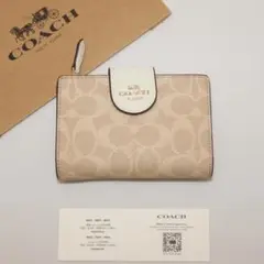 COACH　コーチ　シグネチャー柄　サンド　二つ折り財布