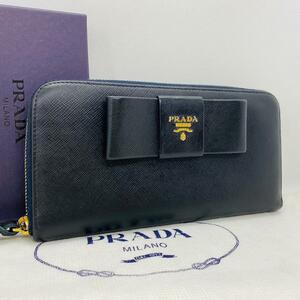 R586 極美品PRADA プラダ ラウンドファスナー 長財布 リボン 小銭入れ カード入れ レザー ネイビー レディース