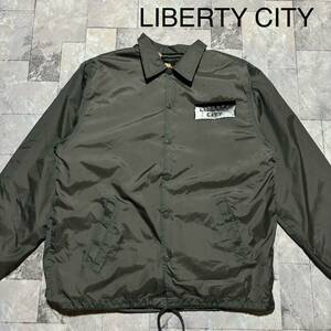 LIBERTY CITY リバティ シティ コーチジャケット ナイロンジャンパー 裏地ボア ビッグプリントロゴ ストリート グレー サイズ2(M)玉FS1349