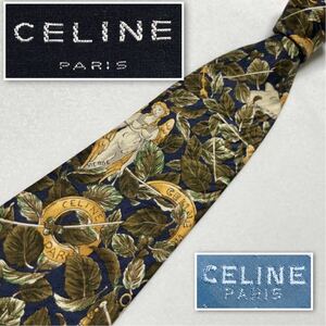 ■美品■CELINE セリーヌ　ネクタイ　翼の生えた処女　葉っぱ　ロゴリング　総柄　シルク100% スペイン製　ネイビー×ブラウン系