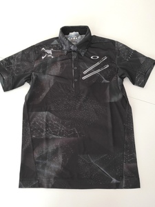 オークリー　ＳＫＵＬＬ　ＢＲＥＡＴＨＡＢＬＥ　ＧＲＡＰＨＩＣ　ＳＨＩＲＴＳ　４３４３９５ＪＰ　(ＢＬＡＣＫ　ＰＲＩＮＴ)　Ｌ