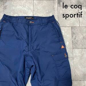 le coq sportif ルコック golf ゴルフパンツ 中綿 防寒 裾ドローコード スポーツ プリントロゴ ブルー サイズL 玉SS1411