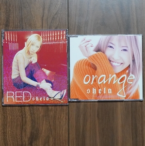 【shela/シェラ/マキシシングルCD×2枚】RED/orange(メッセージカード、初回特典ステッカー付)、どちらも帯有