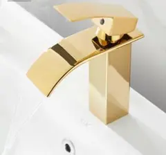 モダンな滝の流域の温水と冷水の洗面化粧台の容器の真鍮の蛇口