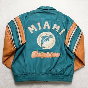 NFL 80s マイアミドルフィンズ【極上の牛革】MIRAGE スタジャン L ライダースジャケット Dolphins 年代物 ブルゾン レザー 青 アメフト 1円