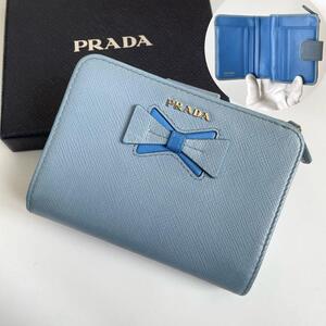 【極美品★箱付き】PRADA プラダ 二つ折り財布 リボン サフィアーノレザー バイカラー 水色 ライトブルー 青 SAFFIANO FIOCCO 1ML018