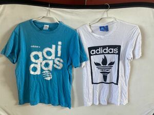 まとめ売りadidas アディダス　TシャツM サイズ　丸首　古着Tシャツ　水色　スポーツ運動　古着好き　聖火デザインロゴ