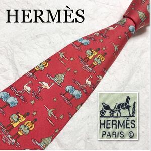 HERMES エルメス　ネクタイ　アフリカの風景　民族楽器を叩く人　星空　三日月　家　木　総柄　シルク100% フランス製　レッド