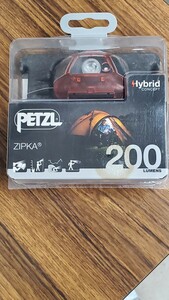 未開封ペツルPETZLジプカ ZIPKA Headlampヘッドランプ最大200ルーメン E93ABB 黒赤コードリール仕様 箱前面に経年経過の電池腐食の汚れ有り