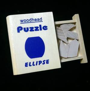 WOOD HEAD PUZZLE Ellipse ケースが丸背の本型