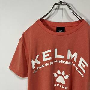 KELME ケルメ ロゴ プリント ワッペン クルーネック ドライ 半袖 Tシャツ 古着 杢オレンジ XS