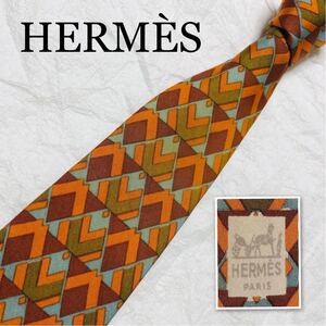 HERMES エルメス　Hタグ　ネクタイ　幾何学模様　総柄　フランス製　オレンジ系