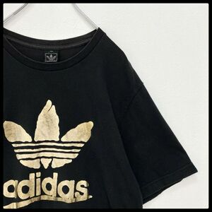 【大人気】アディダス オリジナルス ビッグロゴ 前プリント ゴールド Tシャツ XOサイズ　adidas