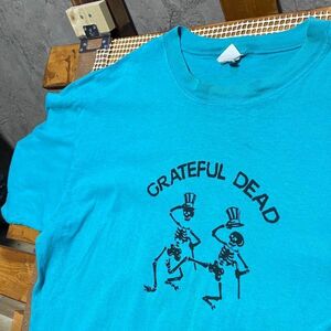 AEBQ 1スタ 水色 バンド Tシャツ グレイトフルデッド GRATEFUL DEAD ガイコツ 90s 00s ビンテージ 古着 卸 仕入れ