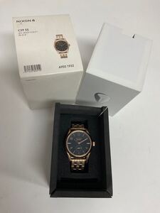 営ST239-60◆ 【未使用品】NIXON ニクソン Refreshing ゴールド×ブラック THE C39 SS クォーツ腕時計 （現状品）