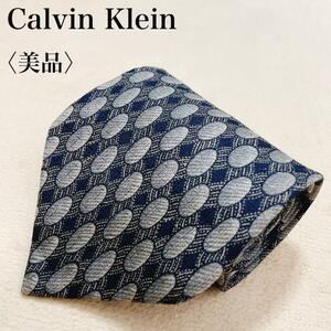 【美品】Calvin Klein カルバンクライン ネクタイ 総柄 シルク 高級感 上品 ゴージャス ブランド ロゴ ドット グレー ネイビー T33