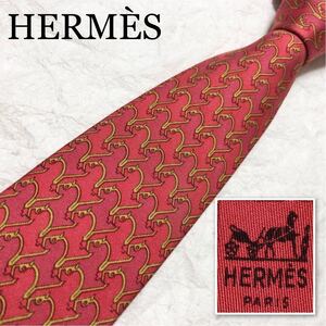 HERMES エルメス　ネクタイ　金具の馬　総柄　シルク100% フランス製　オレンジ系