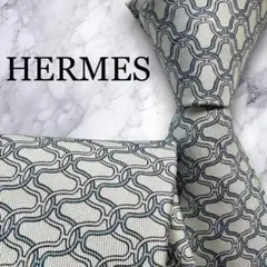 HERMES ネクタイ　エルメス　Hロゴ　水色　春夏　シルク　パターン柄