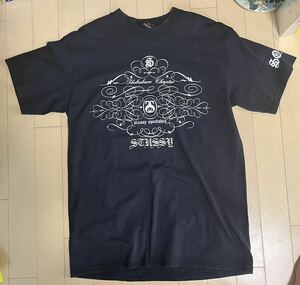 STUSSY ステューシー コラボ SO-CAL speed shop 半袖Tシャツ M BLACK プリント 人物 文字 トライバル