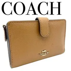 coach コーチ　馬車金具　コンパクト　折財布　二つ折り　ブラウン