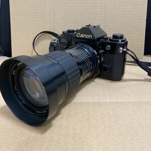 7796 Canon キャノン A-1 一眼レフカメラ SIGMAレンズ付 1:4〜5.6 現状品