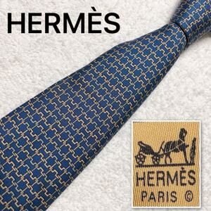 ■傷汚れなし■HERMES エルメス　ネクタイ　H柄モチーフ金具　総柄　シルク100% フランス製　ブルー×ライトオレンジ