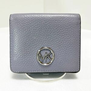 ◆MICHAEL KORS マイケルコース　コンパクト折り財布◆　本革　小銭入れ＆定期入れ有　ロゴ金具　ライトパープル 【USED】 0313