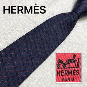 ■美品■HERMES エルメス　ネクタイ　あぶみモチーフ　金具　総柄　シルク100% フランス製　ブルー系　ビジネス