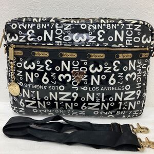 □2−1636 LeSportsac レスポートサック ショルダーバッグ 斜めがけ ジョイリッチ PCバッグ ブラック系 黒系 総柄 エナメル レディース