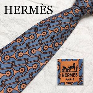 HERMES エルメス　ネクタイ　Hタグ 金具　総柄　レジメンタルストライプ風　シルク100% フランス製　グレー×オレンジ