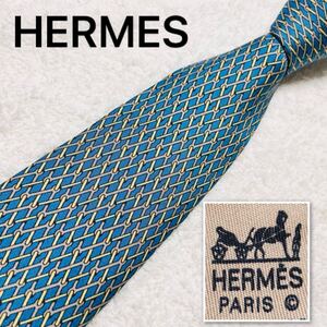 ■美品■HERMES エルメス　ネクタイ　金具　網目状　総柄　シルク100% フランス製　ライトブルー×ベージュ　ビジネス