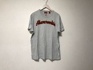 本物アバクロンビーアンドフィッチAbercrombie&Fitchコットンフェルトワッペンロゴ半袖TシャツメンズサーフアメカジグレーXLマカオ製