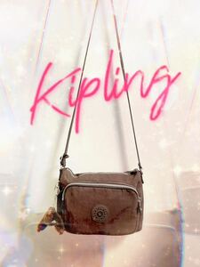 Kipling キプリング マチ付き ショルダー バッグ ブラウン 茶色 モンキー ゴリラ 猿 キーホルダー BAG デパート 百貨店 カジュアル 可愛い