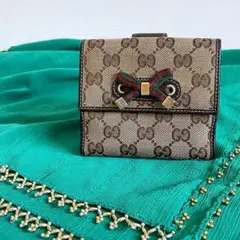 ■559 GUCCI グッチ プリンシー GGキャンバス コンパクト財布 茶