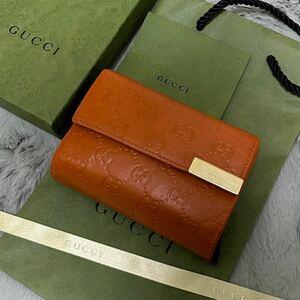 GUCCI グッチ　折り財布　オレンジ　メタルロゴ　シマライン　ラウンドファスナー　