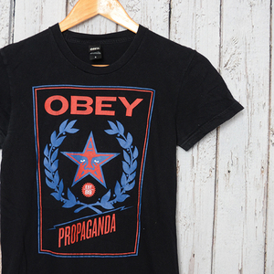 ST1985 オベイ OBEY Tシャツ レディース S 肩37 プロパガンダ メール便可 xq