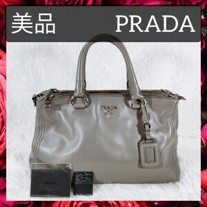 【美品】送料無料 PRADA プラダ ハンドバッグ トートバッグ BN2324 レザー グレー系 グレージュ チャーム付き レディース