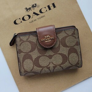 【新品】コーチ　COACH 新作　二つ折り財布　カーキ　サドル