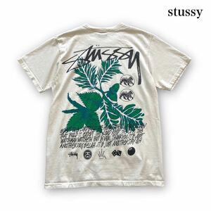 【stussy】ステューシー 半袖Tシャツ リーフ柄バックプリント 8ボール Tee ホワイト 白 ライオン サイコロ ショーンフォント 