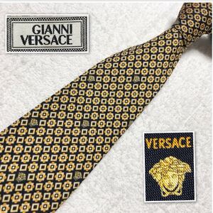 GIANNI VERSACE ジャンニヴェルサーチ　ネクタイ　メドゥーサ　メデューサ　総柄　シルク100% 日本製　ブラック×オレンジ　ビジネス