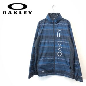 1I2896-F-N◆ oakley オークリー ジャケット パーカー フード収納 ロゴプリント ◆ sizeL ポリエステル ブルー 古着 メンズ 秋冬