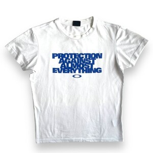 国内正規品★OAKLEY オークリー 半袖 プリント Tシャツ M PROTECTION AGAINST ALMOST EVERYTHING TEE ホワイト 白 トップス カットソー